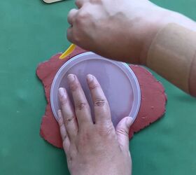 Press a can lid into a piece of clay to get this beautiful and simple wall accent