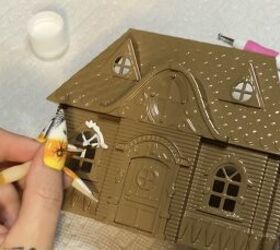 Watch how she makes this Dollar Tree dollhouse into festive Christmas decor