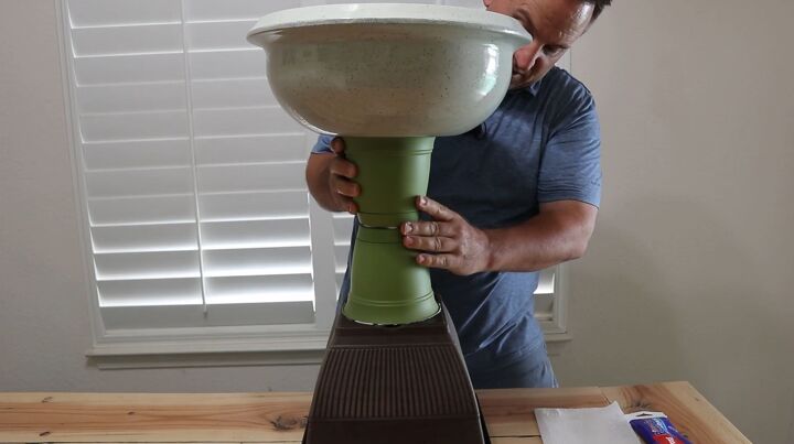 how to turn plastic planters into a beautiful diy urn planter, Connect the two sides of the urn by gluing the pillar pots together