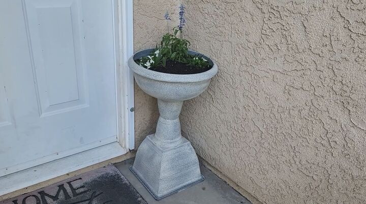 how to turn plastic planters into a beautiful diy urn planter, Here s an example of mine looking lovely on my summer porch