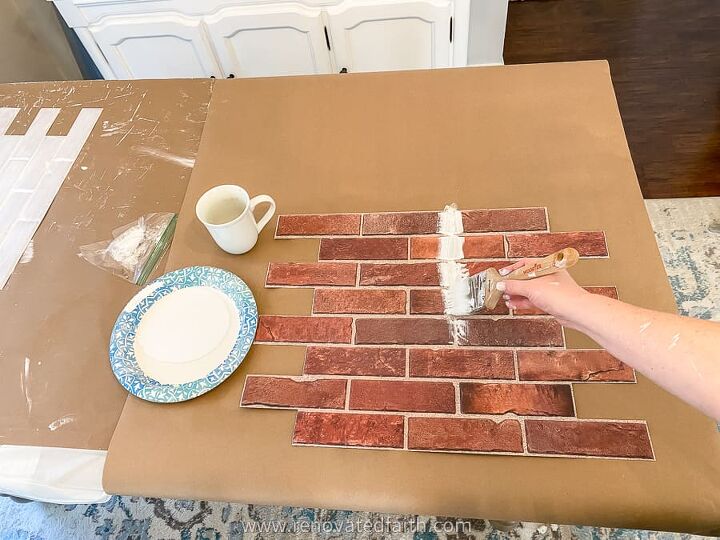 the absolute best faux brick for a backsplash, Here s how I painted on the primer It worked faster to paint in vertical lines down the vertical grout lines and then paint horizontally