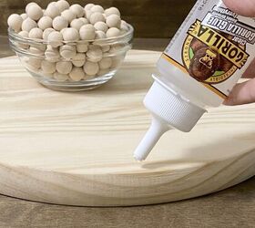 Glue beads to a wood round for an easy way to impress your guests this season