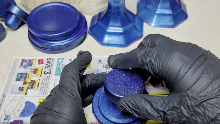 from trash to treasure how to make diy apothecary jars, Dip the corks in the epoxy and center them onto the painted lids