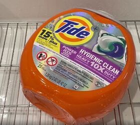 She saves her empty Tide pod container for this brilliant fall decor idea