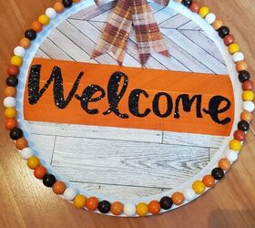 thanksgiving fall dollar tree pizza pan wreath, Gluing bow to pizza pan wreath