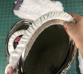 She stretches a steering wheel cover over a cheap metal tray for the coolest idea