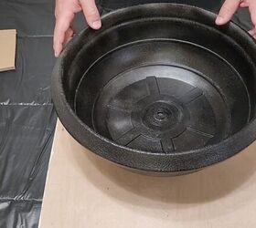 He fills a planter with insulation foam and puts it on his porch for the coolest idea