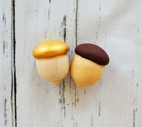 Paint the tops of wooden acorns brown and gold to give your table cute, little boost next week