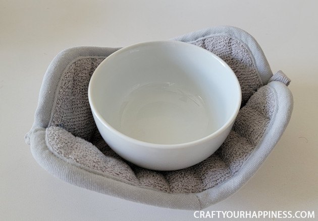 how to make a simple diy bowl cozy from hot pads, Make a DIY bowl cozy using a 2 hot pad No more burned fingers trying to get a hot bowl out of the microwave No sewing machine needed