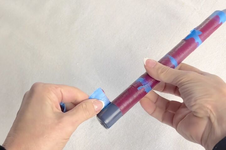 3 quick and easy decorative taper candle projects, Peeling painter s tape from a taper candle