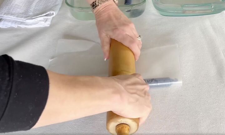 3 quick and easy decorative taper candle projects, Flattening the middle part of a taper candle with a rolling pin
