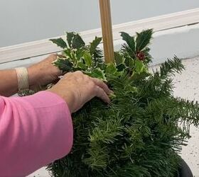 7 simple steps to make this festive diy christmas topiary, Adding Christmas picks to decorate the Styrofoam ball