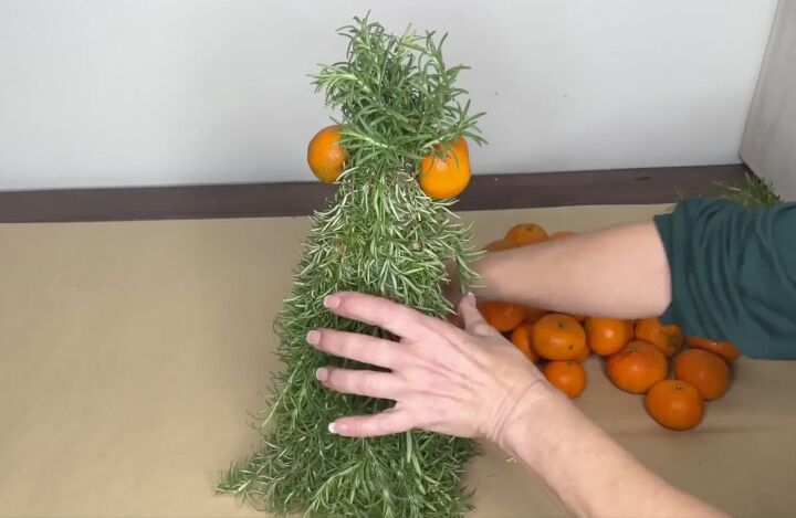 3 easy citrus dcor ideas to upgrade your home for the holidays, Attaching oranges to a cone