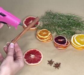 3 easy citrus dcor ideas to upgrade your home for the holidays, Gluing cinnamon to a dried citrus slice