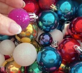 a breathtaking jumbo christmas ball wreath in 3 easy steps, Adding miniature Christmas balls to the jumbo wreath