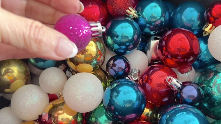 a breathtaking jumbo christmas ball wreath in 3 easy steps, Adding miniature Christmas balls to the jumbo wreath