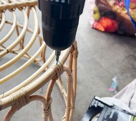 how to make a chic boho style end table with baskets from ikea, Unscrewing the screws on the bottom