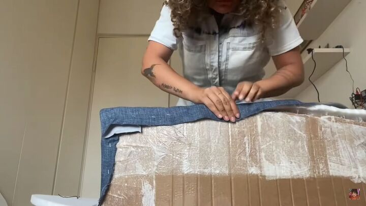 how to make a diy cardboard couch in a chic round style, Stapling fabric to the cardboard