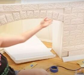how to make an easy diy foam fireplace without using power tools, Placing the brick tiles on the facade