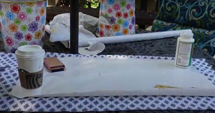 how to make a chic diy round end table out of cheap trash cans, Cutting fabric to cover the trash cans