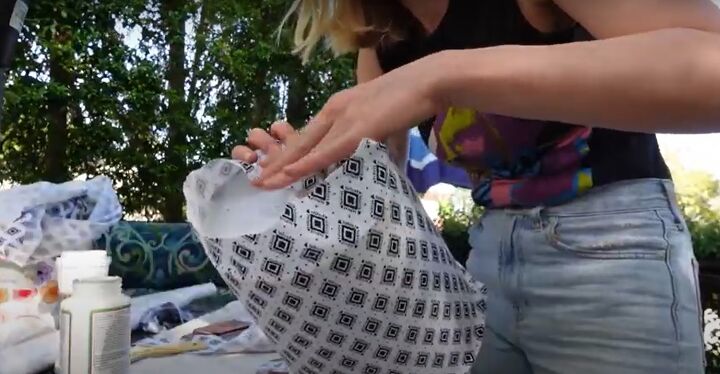 how to make a chic diy round end table out of cheap trash cans, Applying the fabric with ModPodge