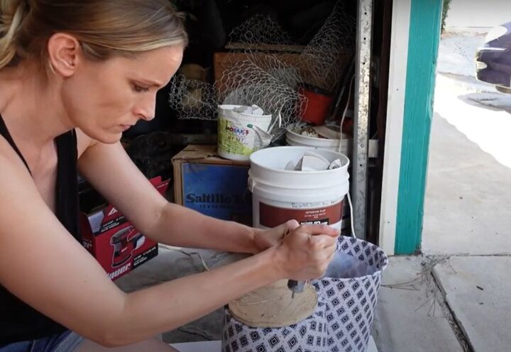 how to make a chic diy round end table out of cheap trash cans, Gluing the trash cans together