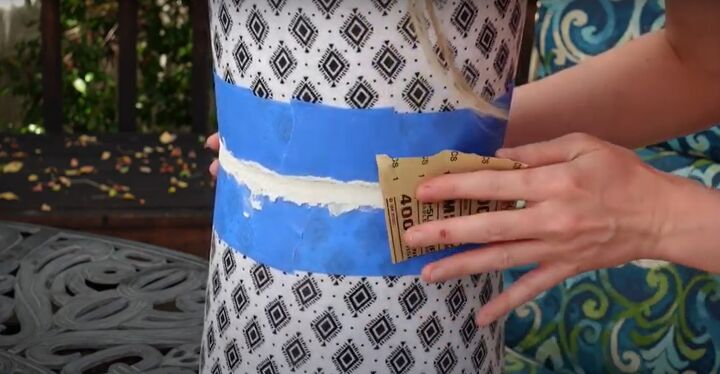 how to make a chic diy round end table out of cheap trash cans, Sanding the spackle