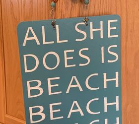 utiliza una tabla sujetapapeles para hacer un bonito cartel de playa
