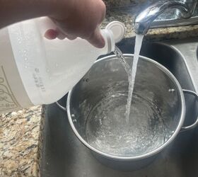 She fills a pot with vinegar, then grabs the Bar Keeper's Friend and does <em>this</em>