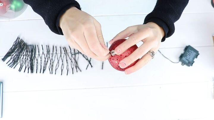 christmas decor how to make a beautiful diy ornament garland, Removing the hook from the Christmas bauble