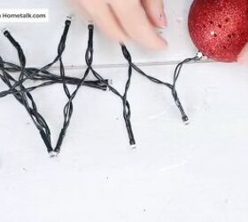 christmas decor how to make a beautiful diy ornament garland, The first ornament attached to the string lights