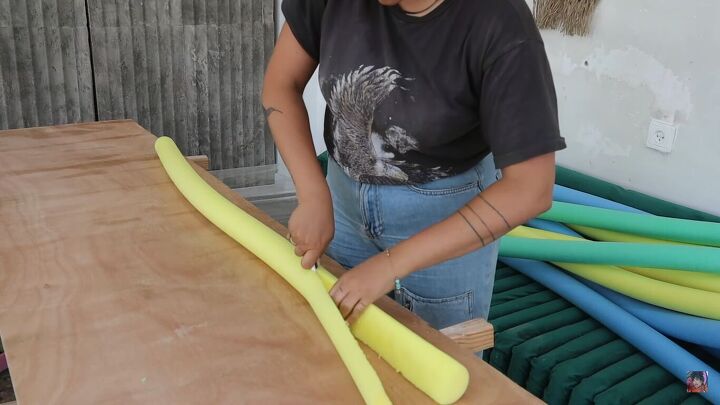 how to make an awesome pool noodle bed frame in 6 simple steps, Cutting the pool noodles in half