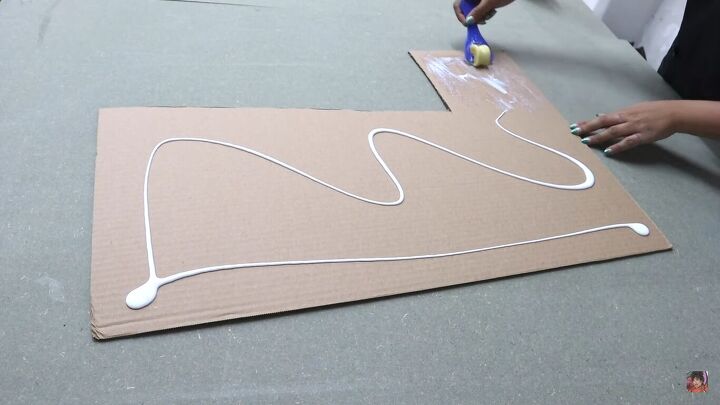 how to make a cardboard chair that holds weight looks chic, Spreading glue on the L shape