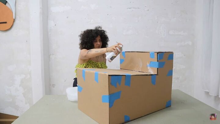 how to make a cardboard chair that holds weight looks chic, Covering the chair in spray glue