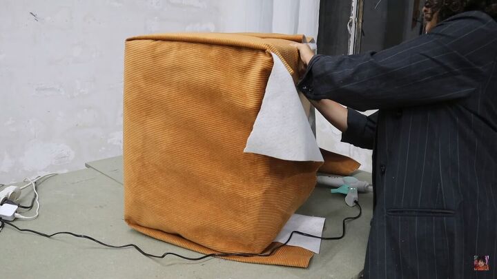how to make a cardboard chair that holds weight looks chic, Gluing the bottom of the fabric to the base