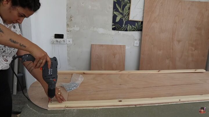 how to make a funky diy couch out of pool noodles, Drilling beams in place