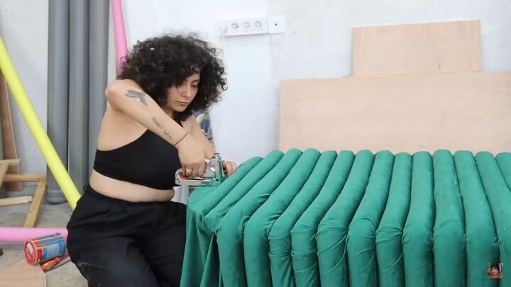 how to make a funky diy couch out of pool noodles, Stapling the pool noodles