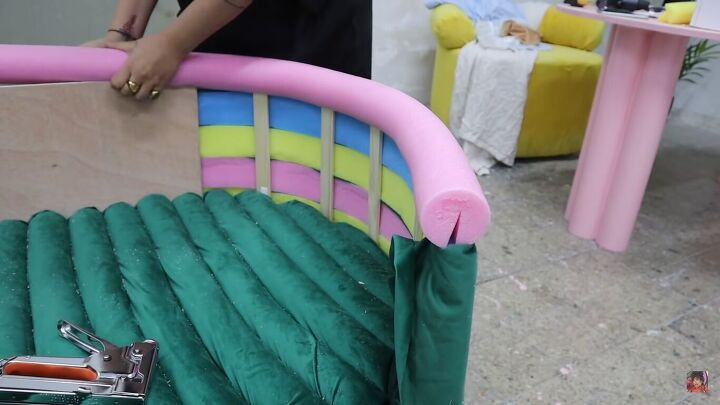 how to make a funky diy couch out of pool noodles, Sliding a pool noodle onto the top of the couch