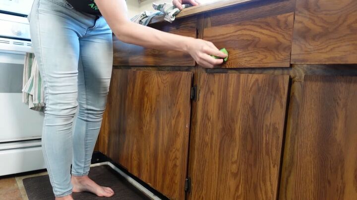 how to do a 70s old kitchen cabinets makeover on a budget, Wiping down the cabinets