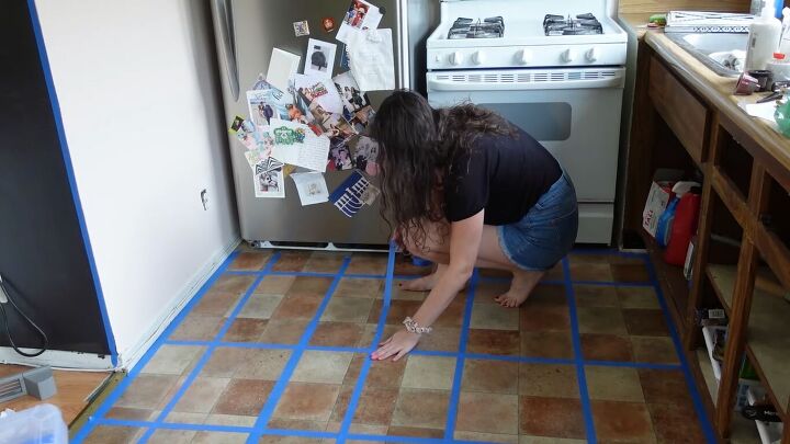 how to do a 70s old kitchen cabinets makeover on a budget, Applying painter s tape in a grid