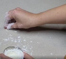 7 money saving cornstarch cleaning hacks for a spotless home, Rubbing a cornstarch paste onto an oily stain on fabric