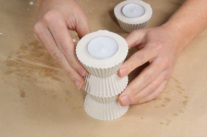 how to create stunning cupcake candle holders with plaster of paris, Stacking the fourth plaster cupcake with a tealight in it on the top