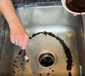 7 astonishing coffee grounds hacks to save you time and money, Coffee grounds being spread around a stainless steel sink