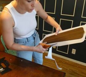 how to create an impressive dining room accent wall for only 70, Applying contact paper to the ceiling fan blades