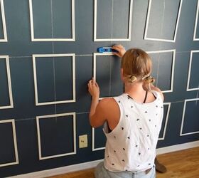 how to create an impressive dining room accent wall for only 70, Using command strips to attach the frames