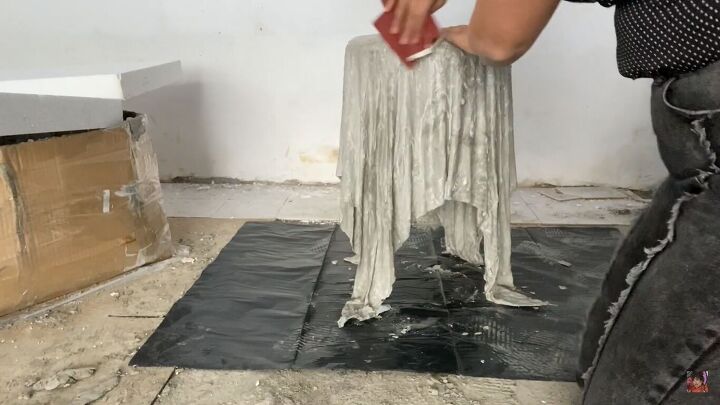 how to make a concrete side table with a cool optical illusion, Sanding the DIY concrete side table