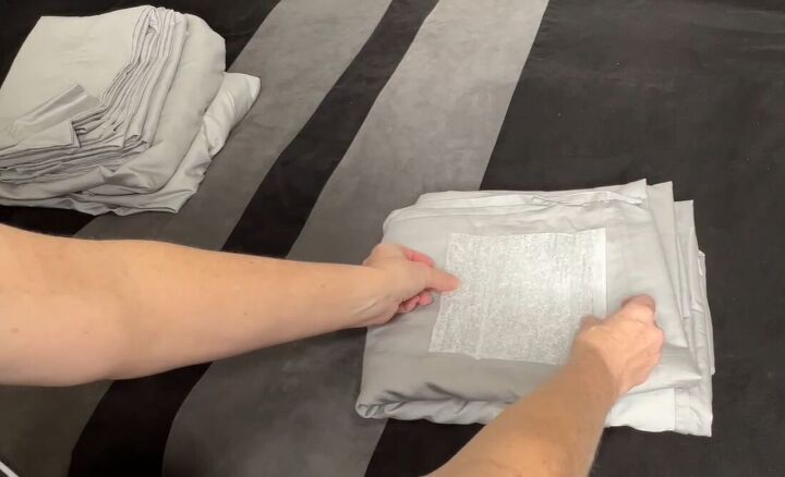 6 dryer sheet hacks the secret to effortless cleaning, Placing a dryer sheet between linen before storing them in the closet