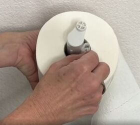 6 dryer sheet hacks the secret to effortless cleaning, Placing a folded dryer sheet inside a toilet paper roll