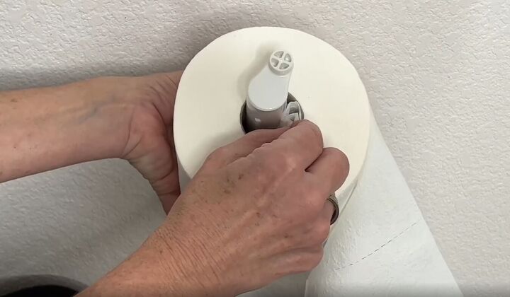6 dryer sheet hacks the secret to effortless cleaning, Placing a folded dryer sheet inside a toilet paper roll