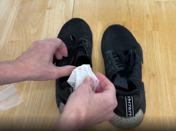 6 dryer sheet hacks the secret to effortless cleaning, Placing a dryer sheet inside sneaker